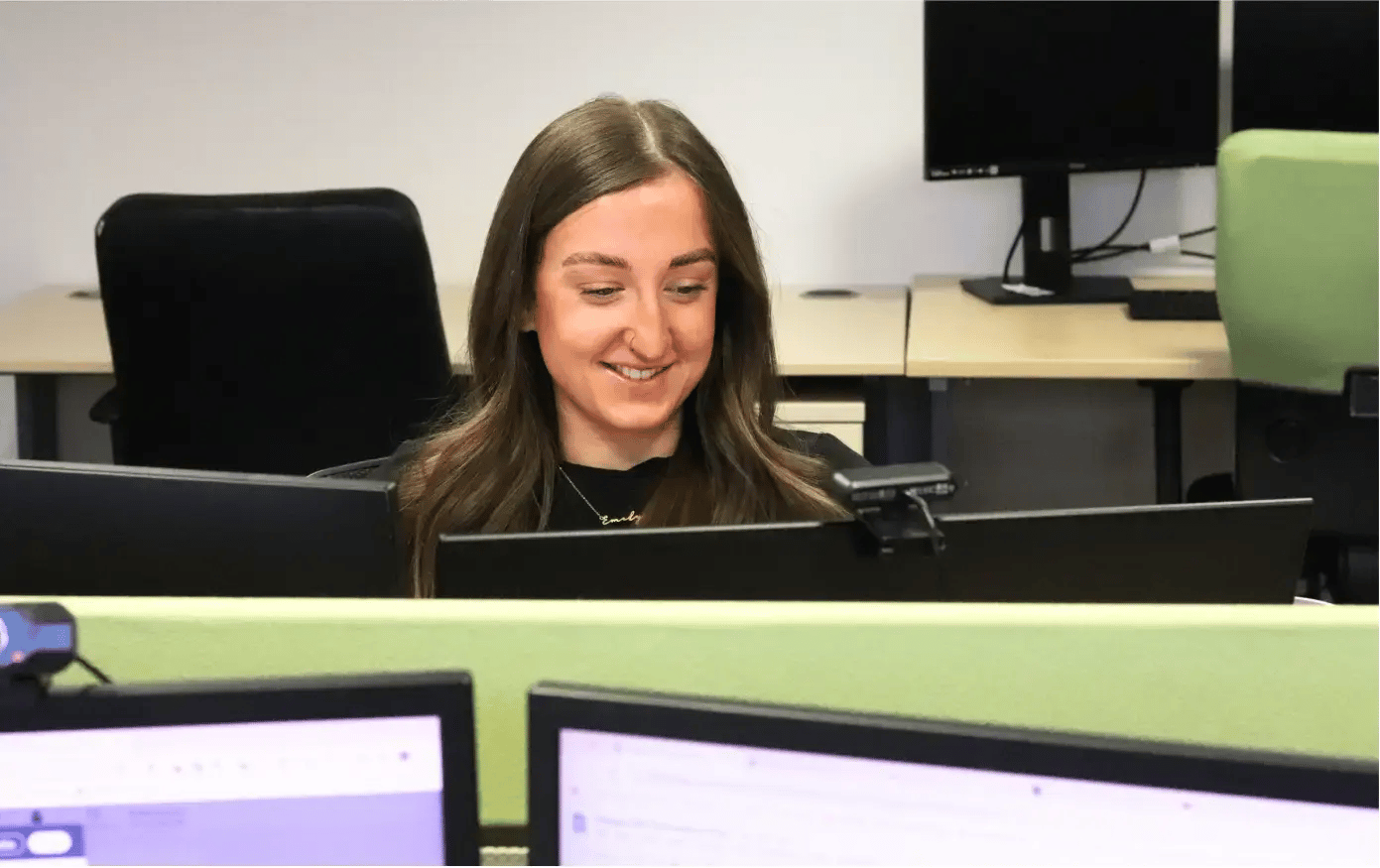 Emily at her desk