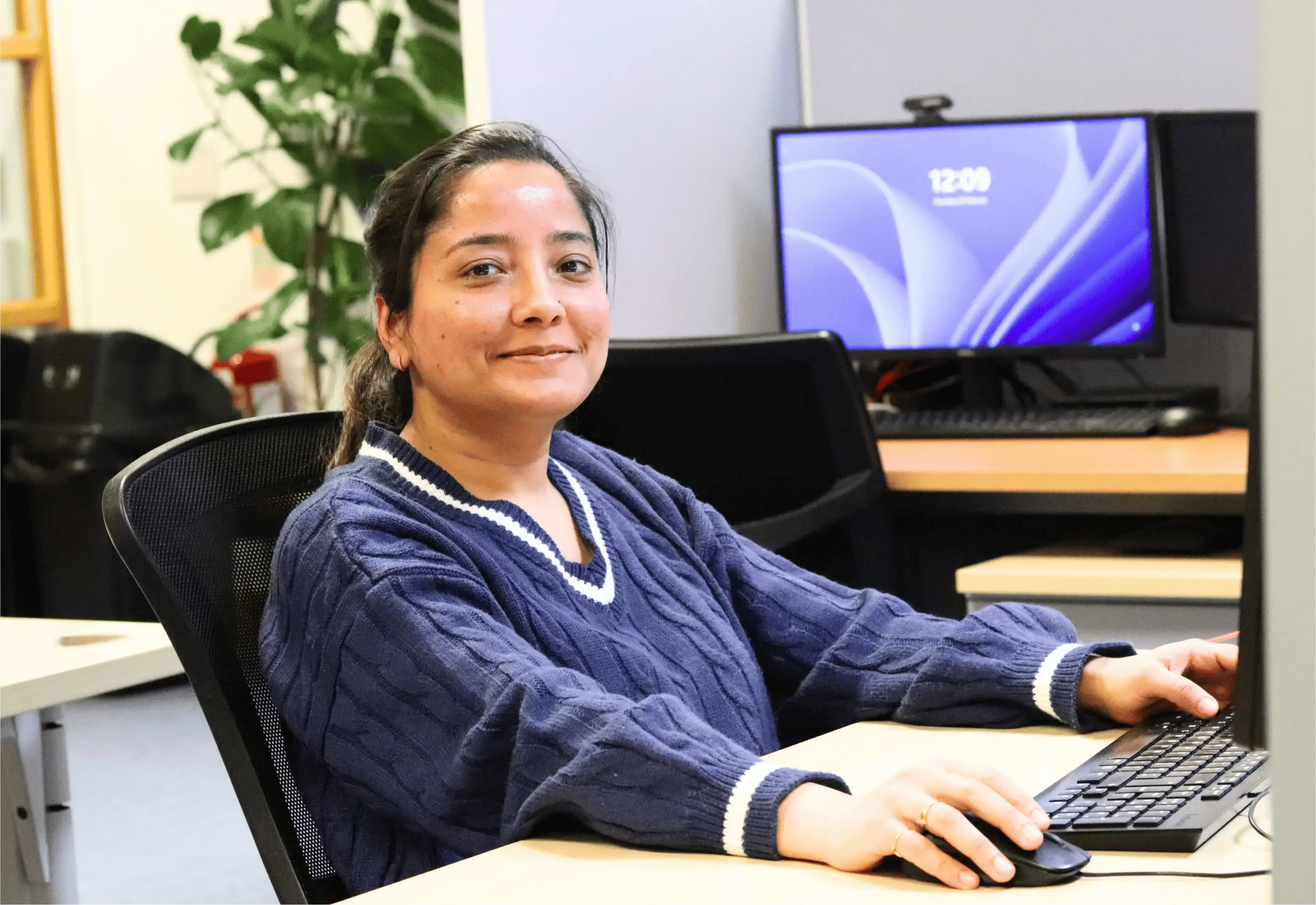Taran working at her desk on LinkedIn
