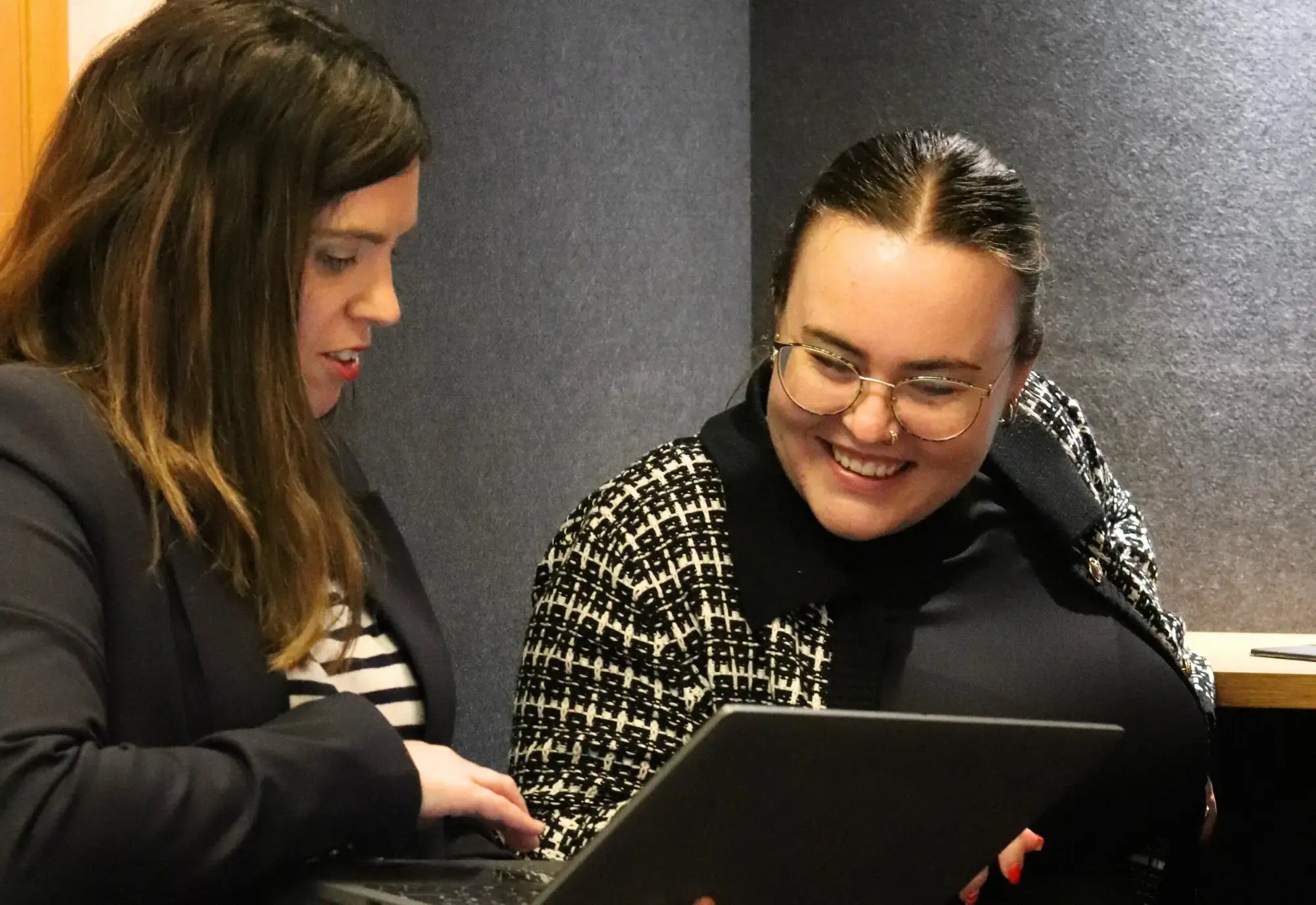 Shirley and Ellis discussing website costs