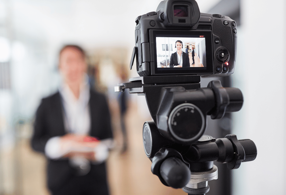 A business person making their own in house video that will be used for their marketing.