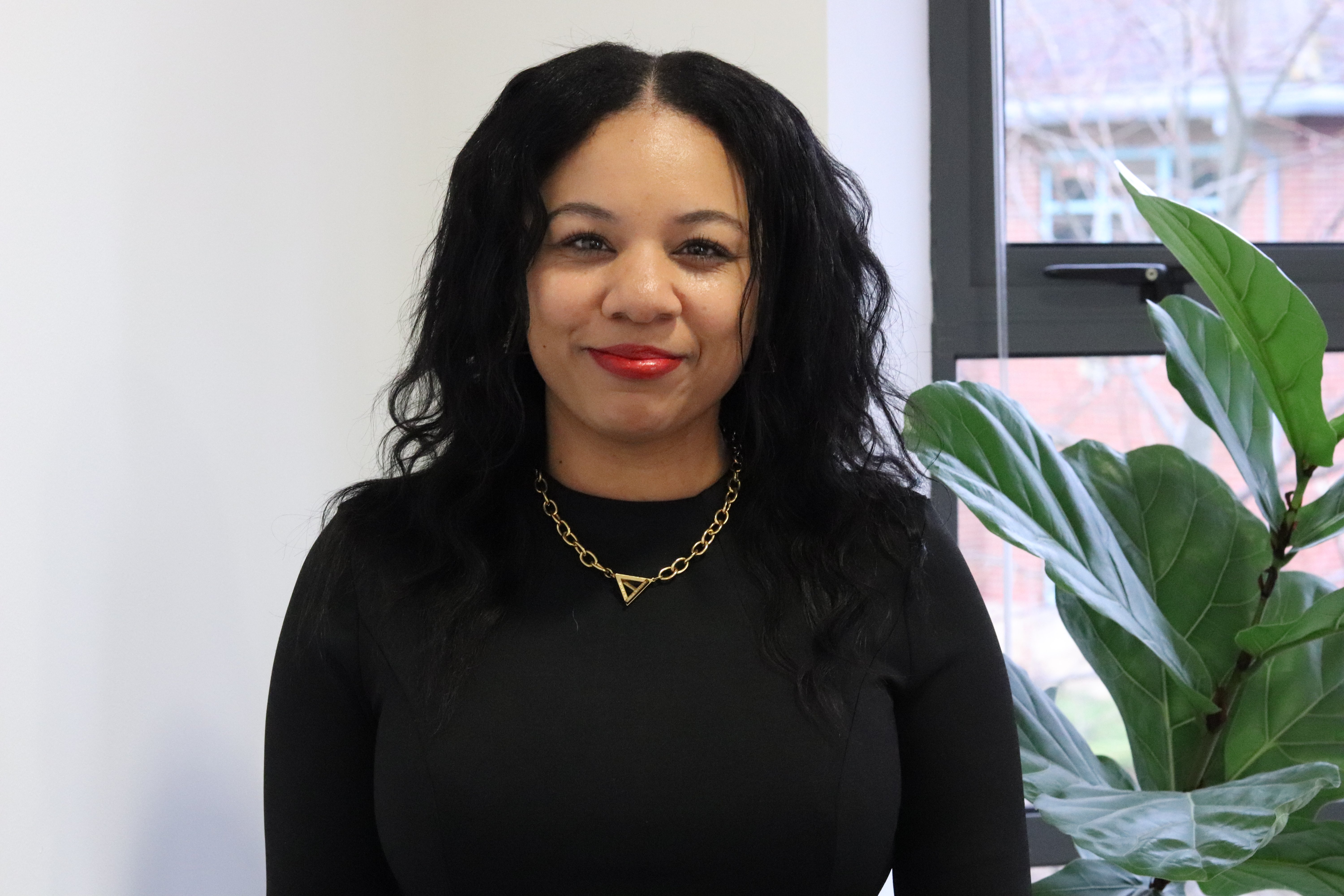 Kerry from JDR proudly presenting to a client a breakdown of the best social media management tools for 2026.