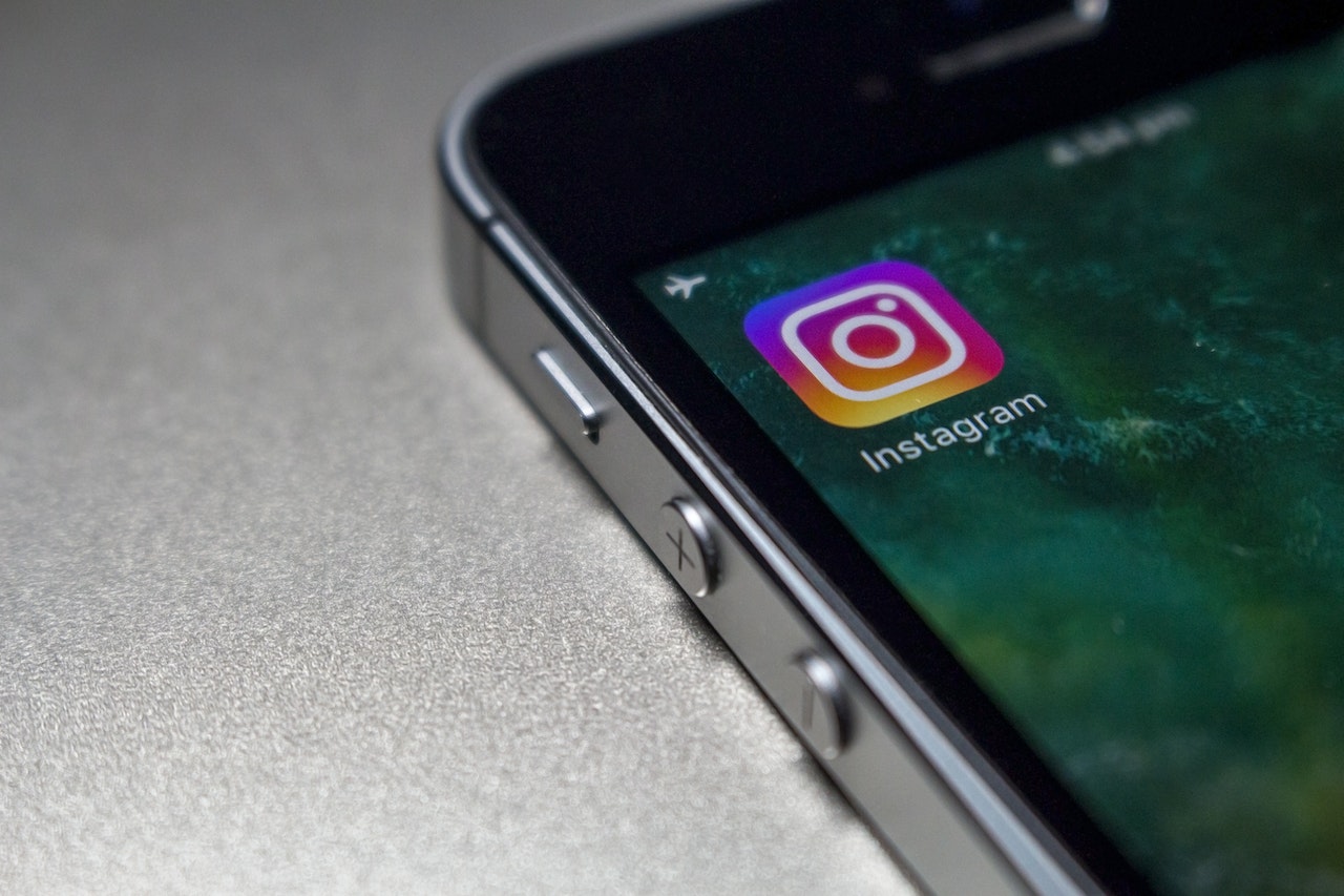 Someone about to tap on the Instagram app on their iPhone, a Meta social media software, spoken about at this year's Meta Marketing Summit EMEA.