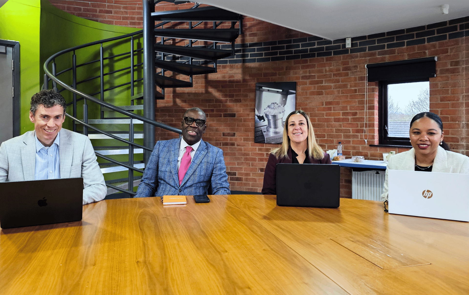 Team of professional marketers proudly smile at the camera. 