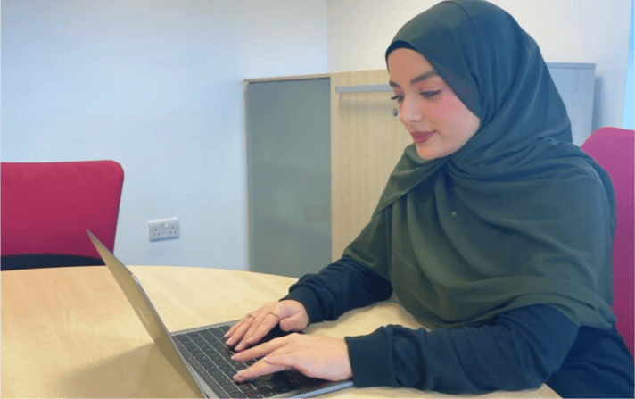 Nidia from JDR testing a chatbot functionality on a client's website. 