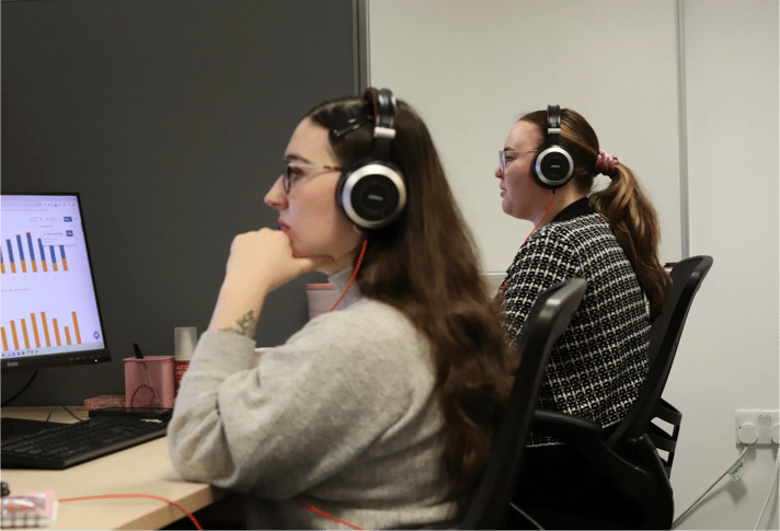 Danni and Ellis from JDR analysing data.