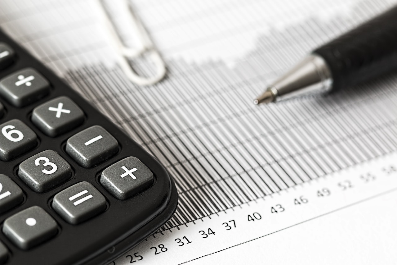 An accountant calculating the ROI of referral marketing compared to inbound marketing when acquiring new clients