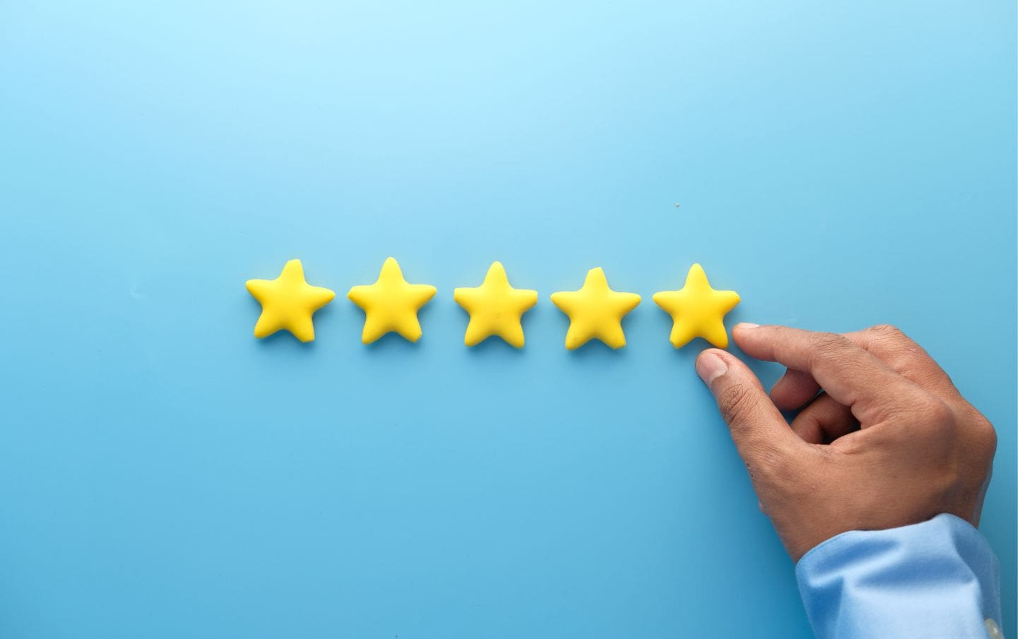 A business owner organising his five stars from his customer's reviews to leverage and boost business reputation and sales