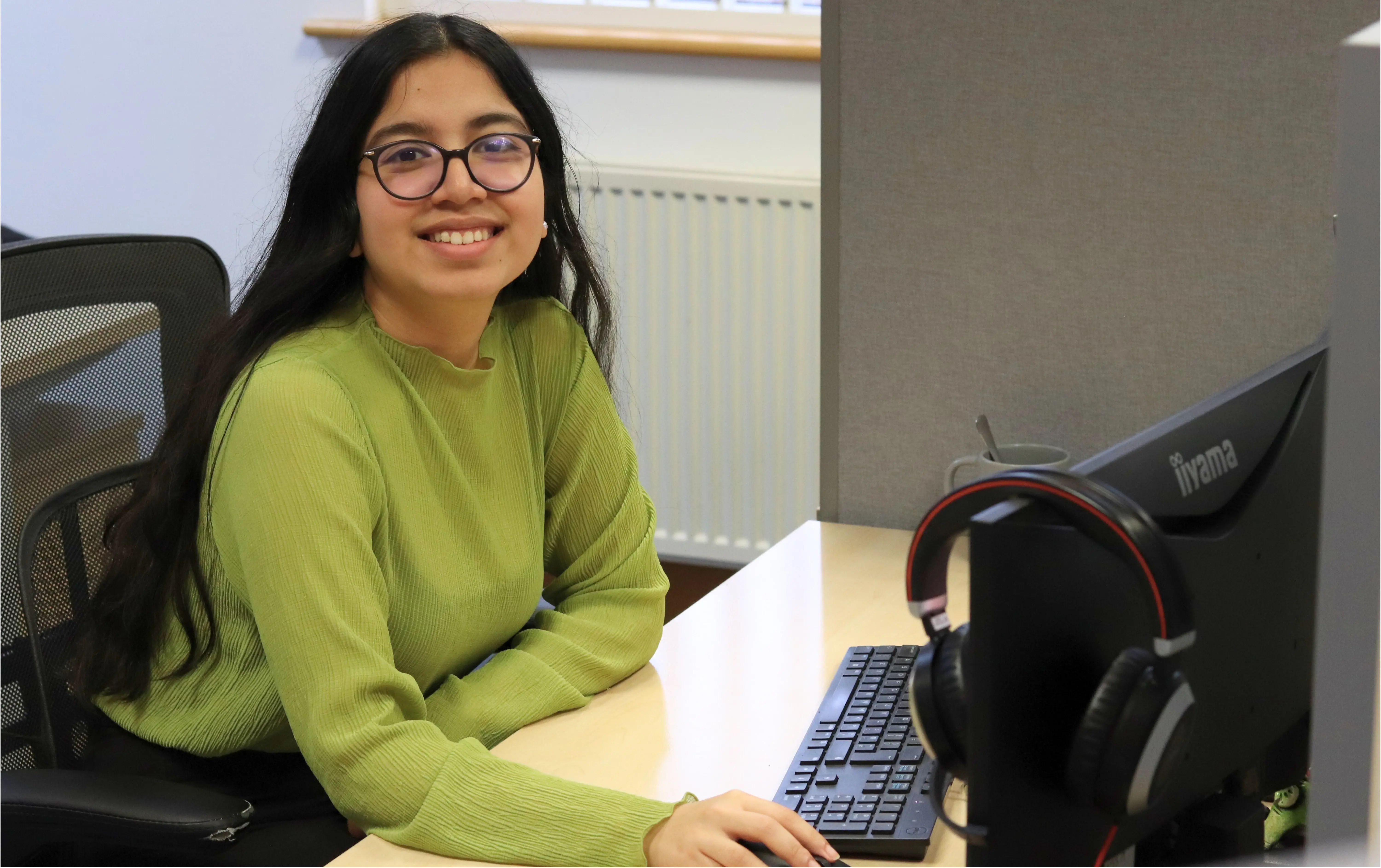 Ayesha demonstrating CRM functionality to a client, representing how clients are guided through the benefits of HubSpot versus Microsoft Dynamics.