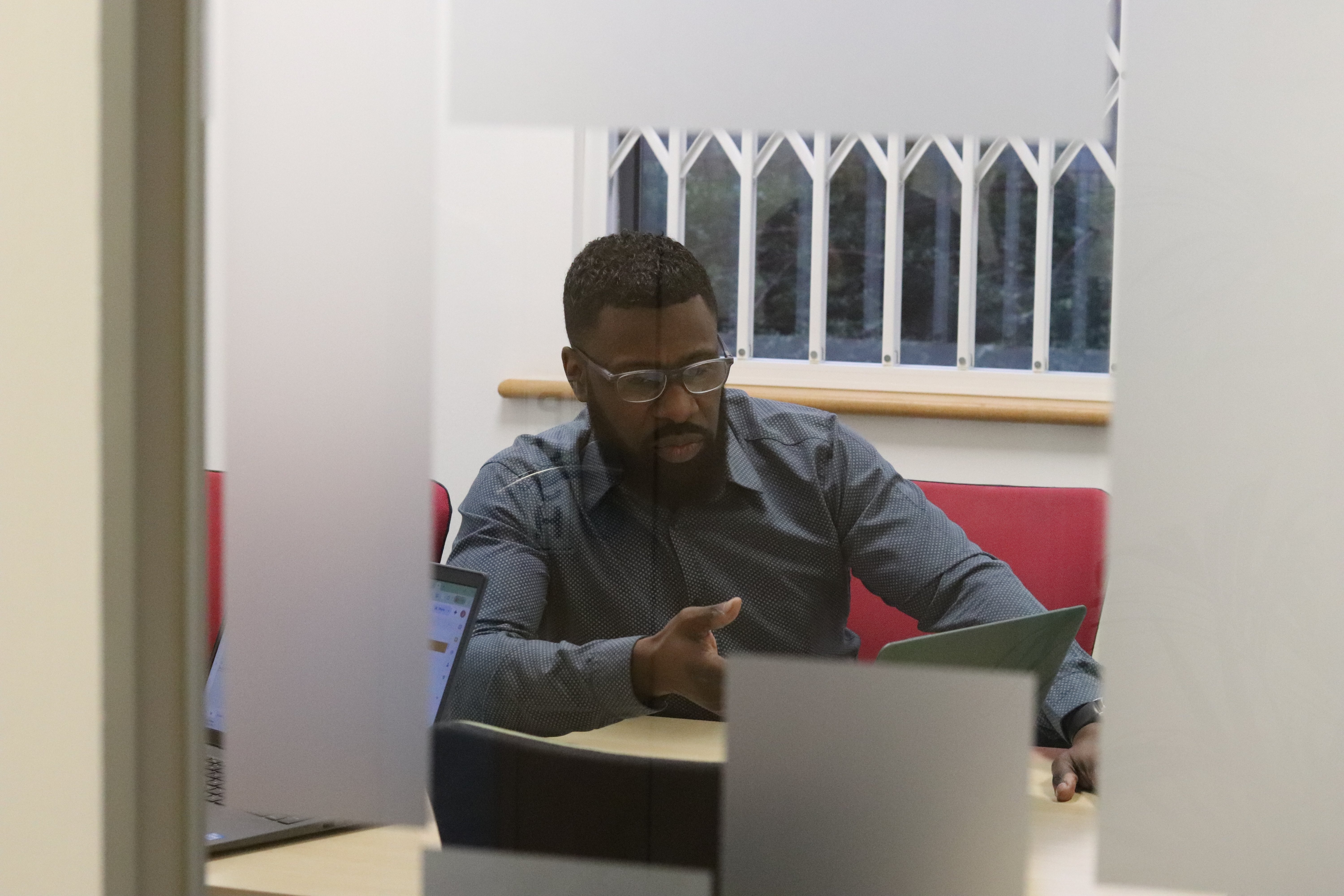 Dan in a meeting talking through an inbound marketing strategy to help an SME compete with a bigger company.