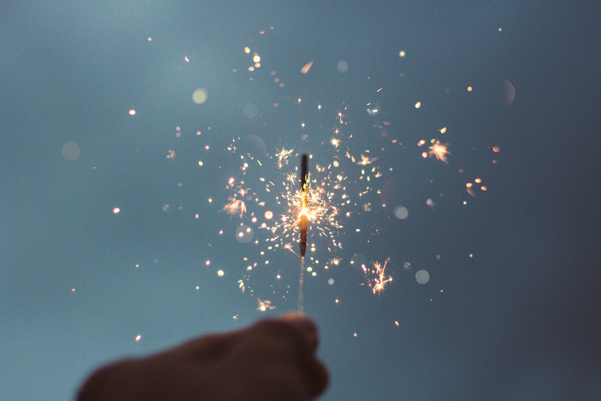 JDR Group holding up a sparkler in celebration of achieving HubSpot Elite Partner Status