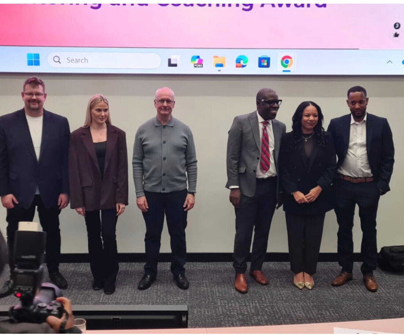 Dave and Kerry with a group of people getting their photo taken at the University of Derby Game Changer Awards.
