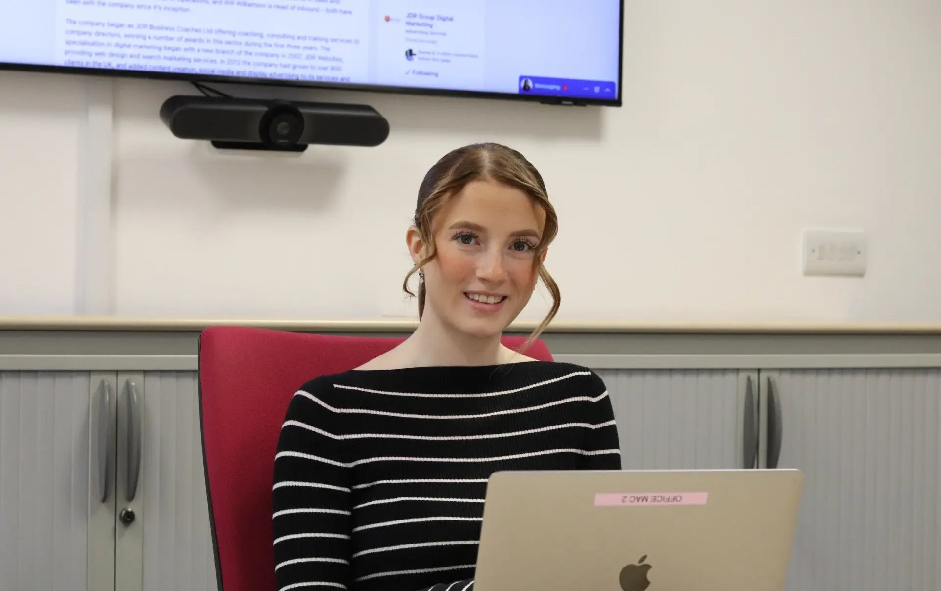 Ellie from JDR Group working on AI-driven paid social strategy, reviewing Meta ad campaign performance on her laptop.