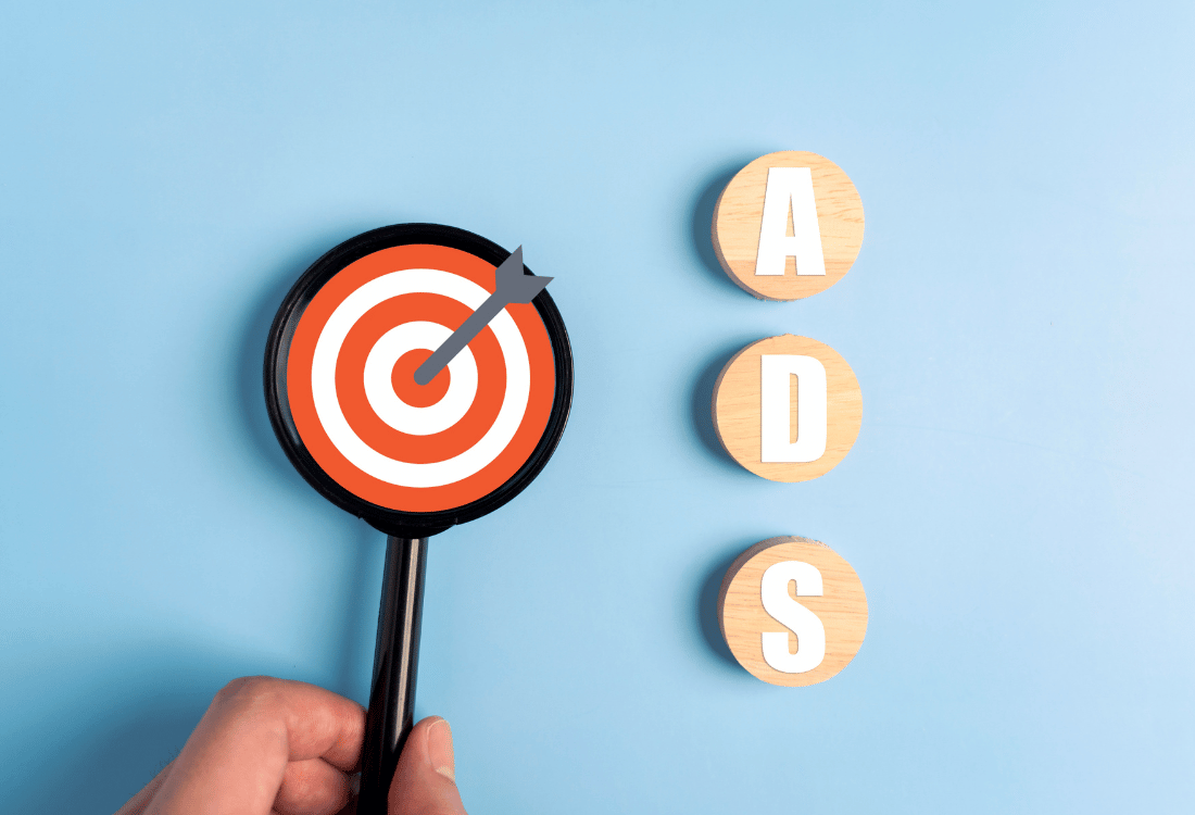 Ads written on three circles next to a mini dartboard with a dart.