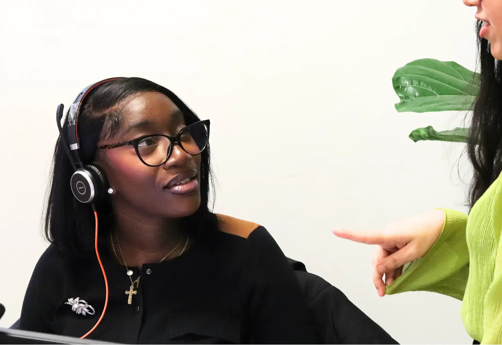 Chelsea sat at her desk speaking with A