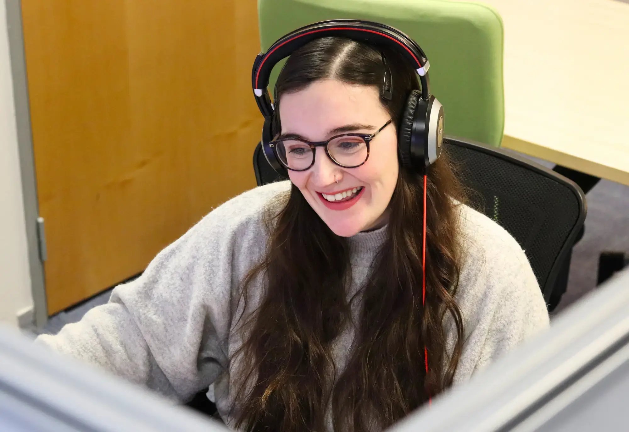 Danni working at her desk in the JDR office in Derby