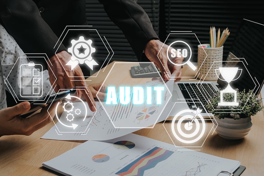 A man holding a report highlighting the importance of an inbound marketing audit'