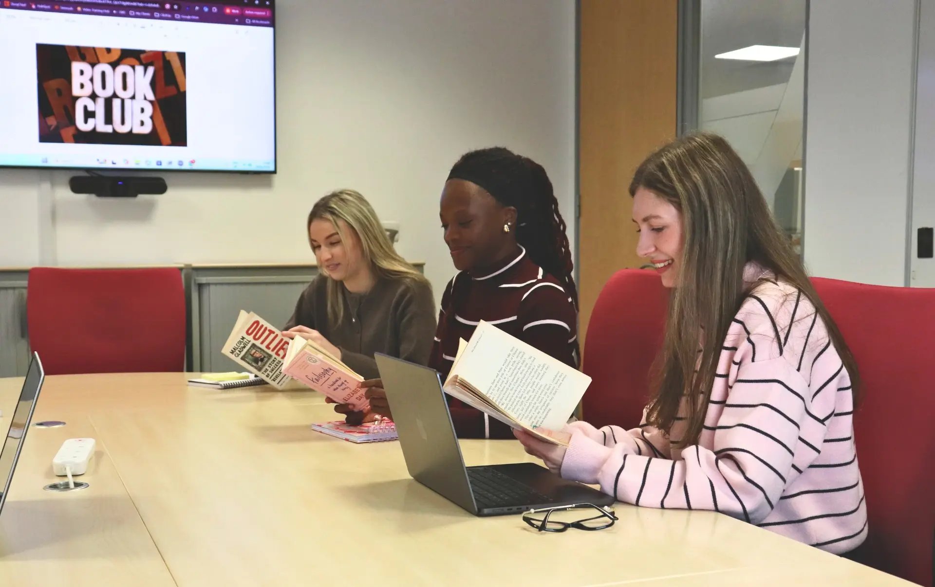 JDR team members Sophie, Mia and Emily reviewing buyer-focused content as part of a ‘They Ask, You Answer’ content strategy session.