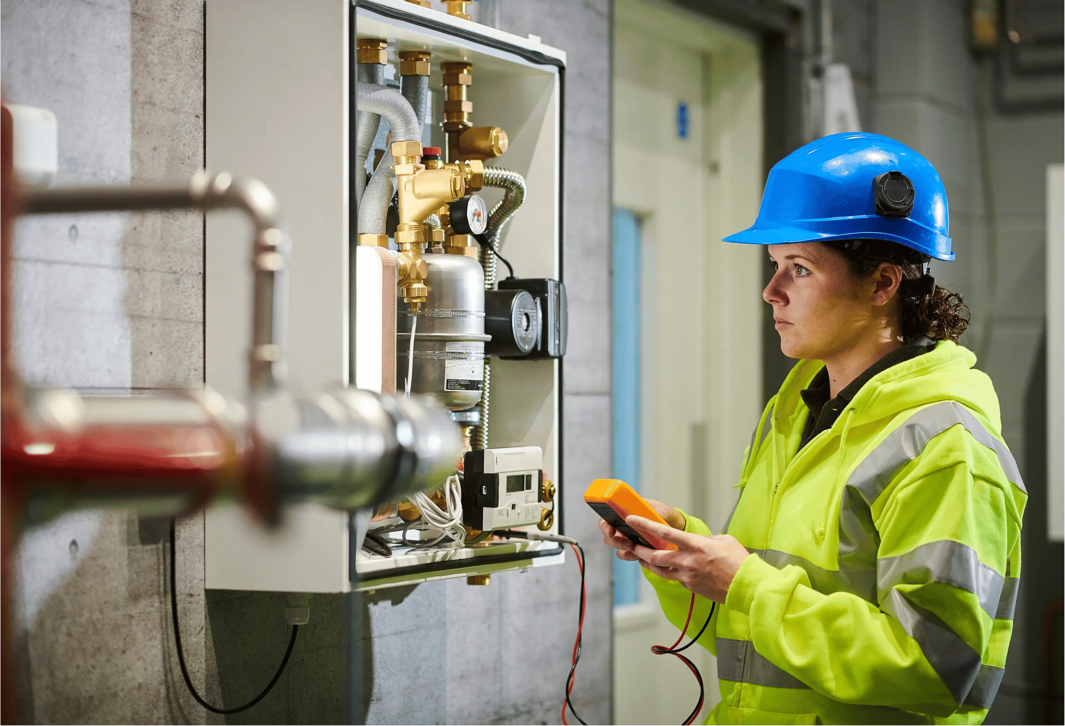 Female electrician carrying out an inspection.