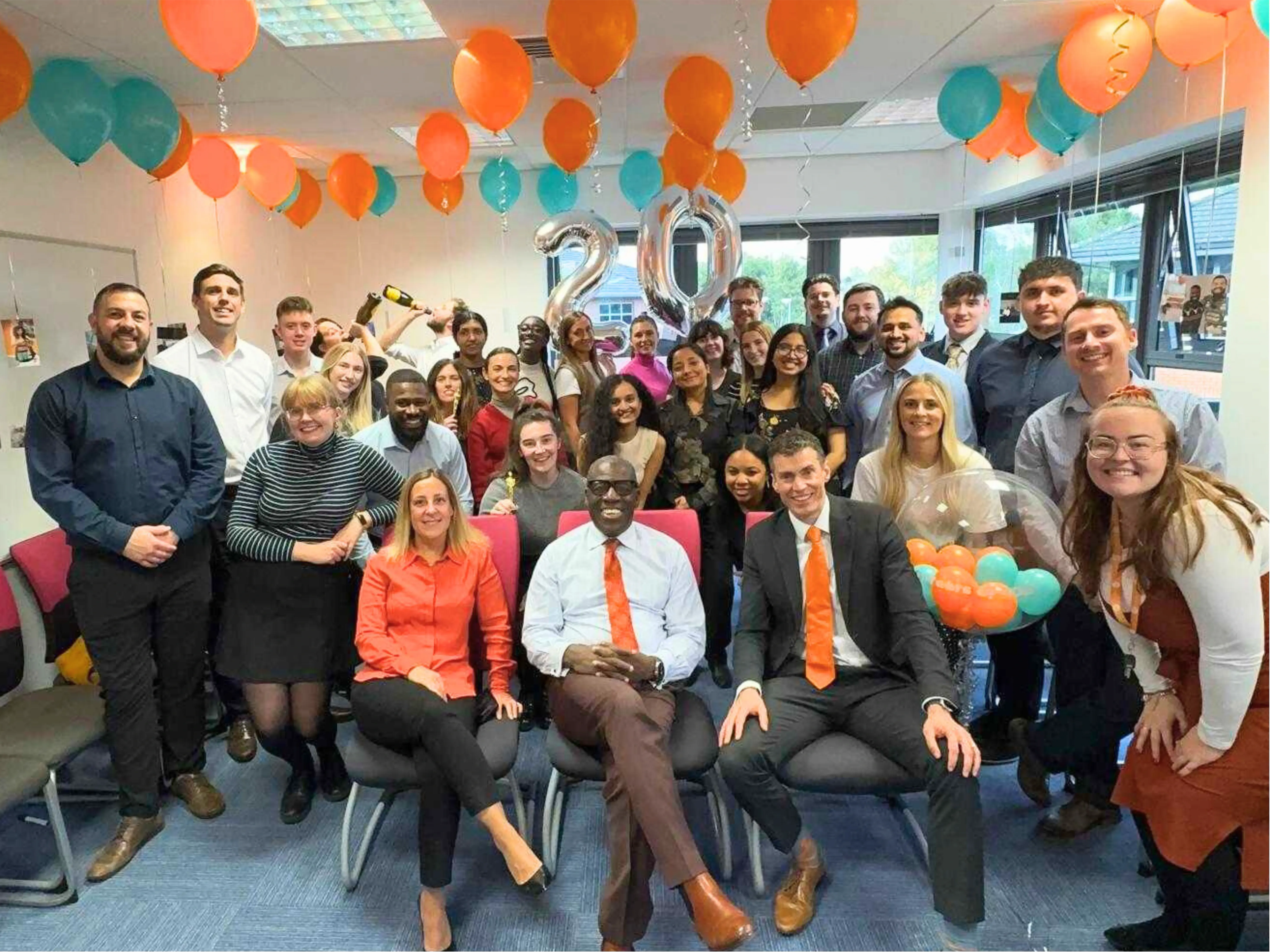 JDR Team celebrating their company's 20th anniversary.