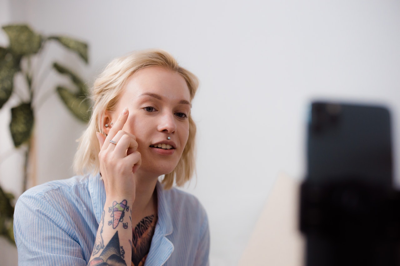 A businesswoman demonstrating her business's product in a short video to help drive sales and leads from social media