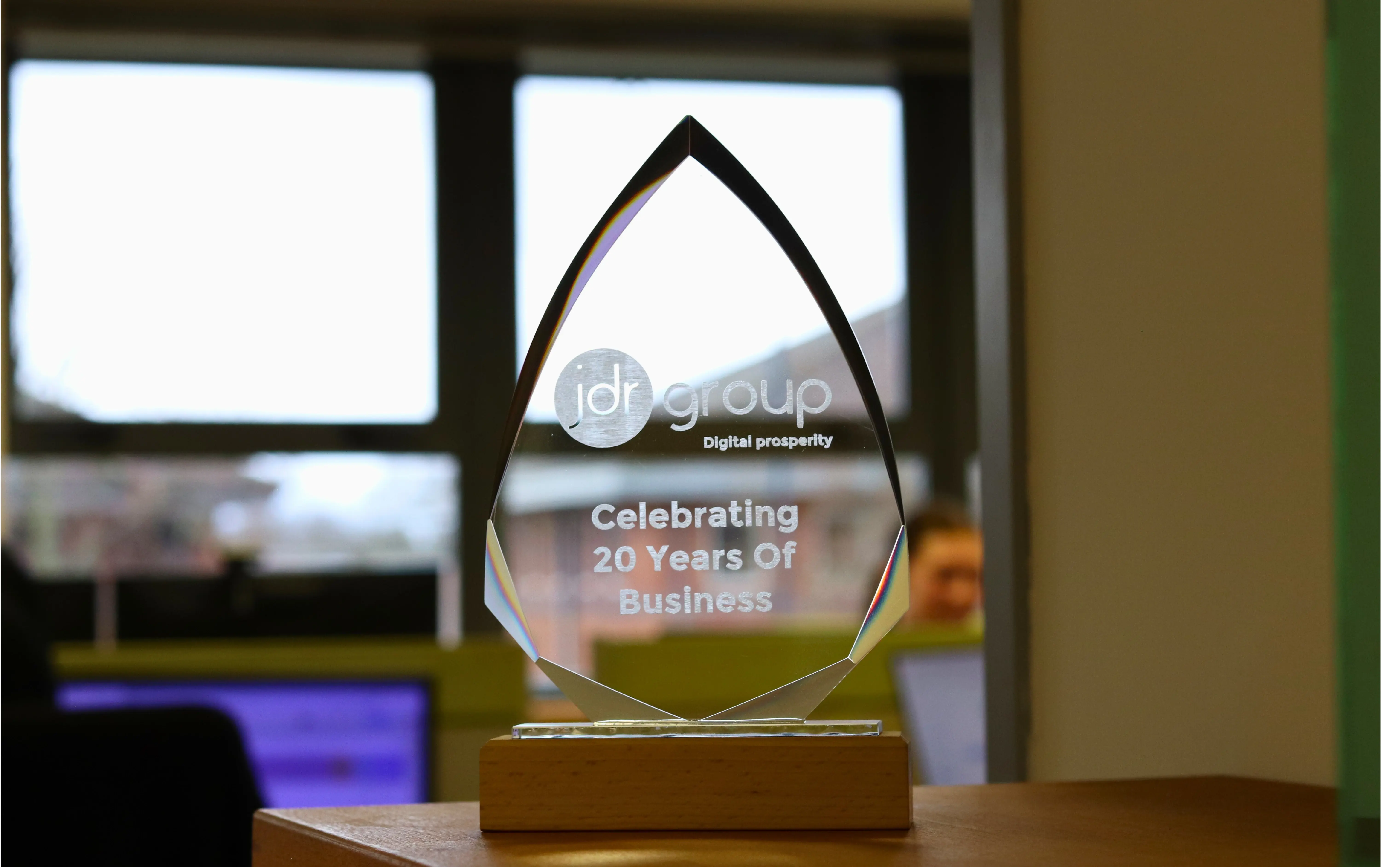 JDR Group award celebrating 20 years in business, symbolising growth beyond word of mouth and the need for a scalable marketing strategy.