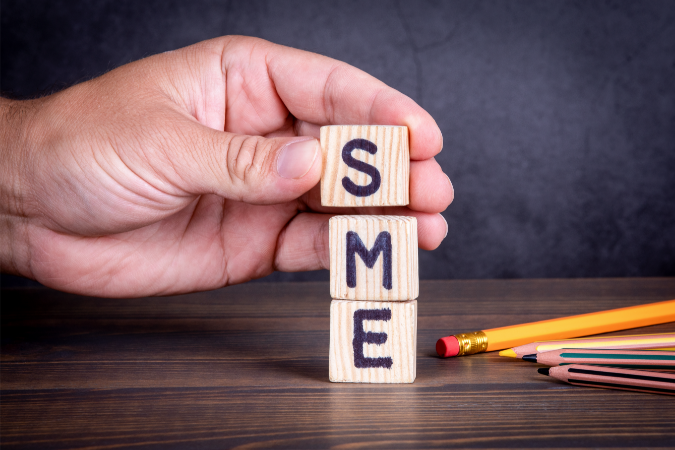 Three blocks spelling out SME to show practical strategies to help boost SME B2C sales for UK business owners
