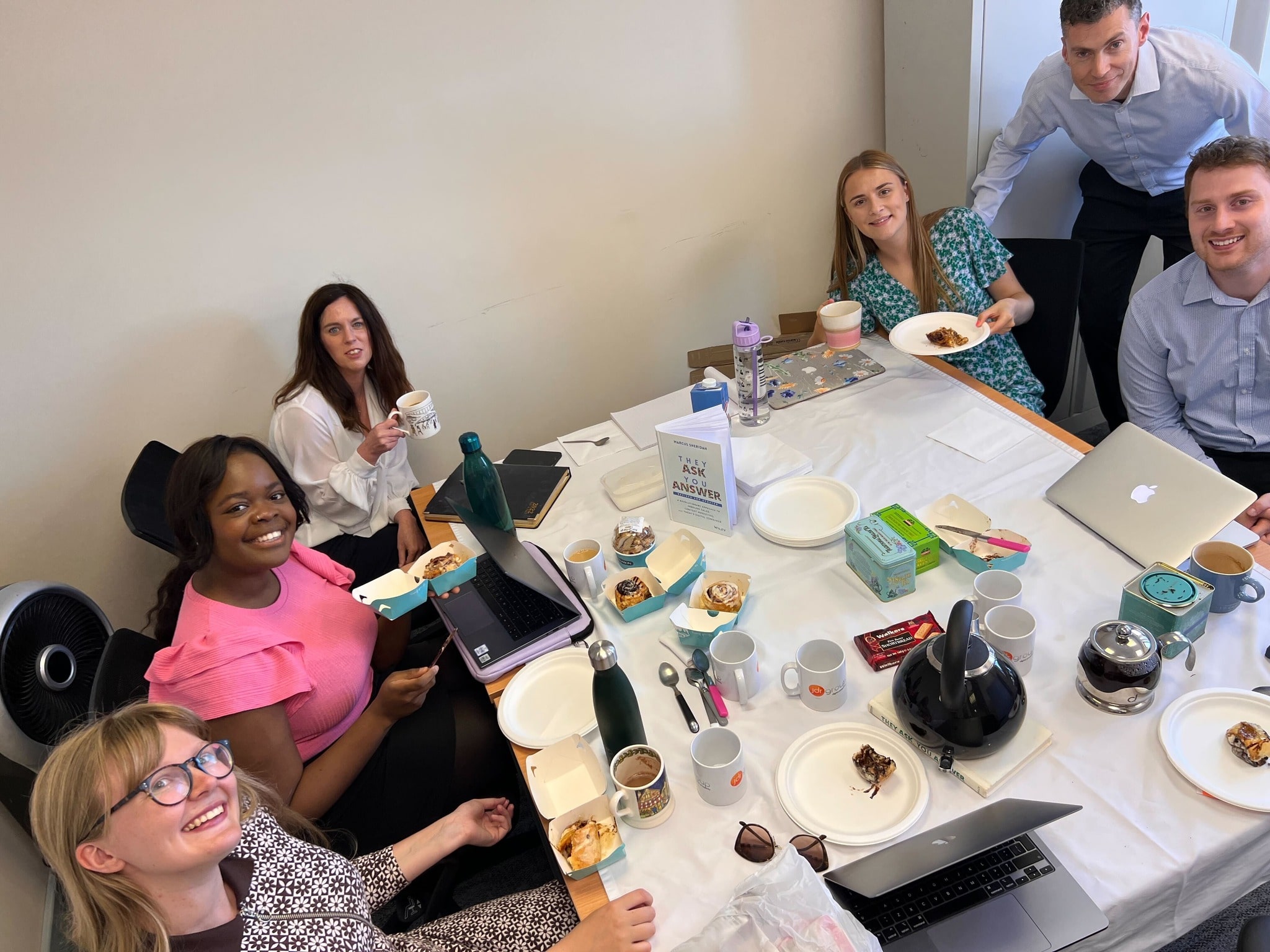 A group of the JDR team having tea and cakes during the first JDR book club