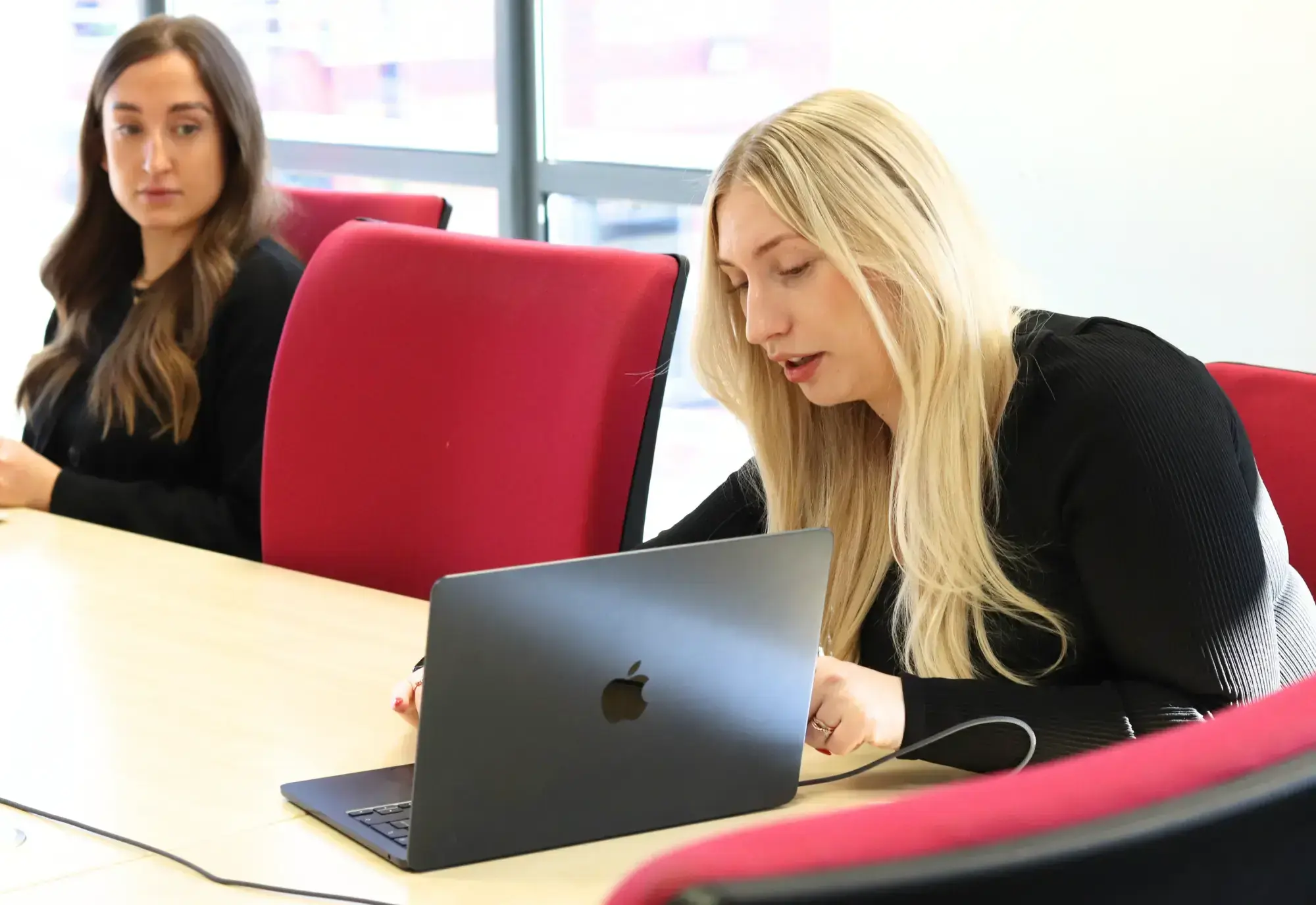 Amber and Emily from JDR working on a website project