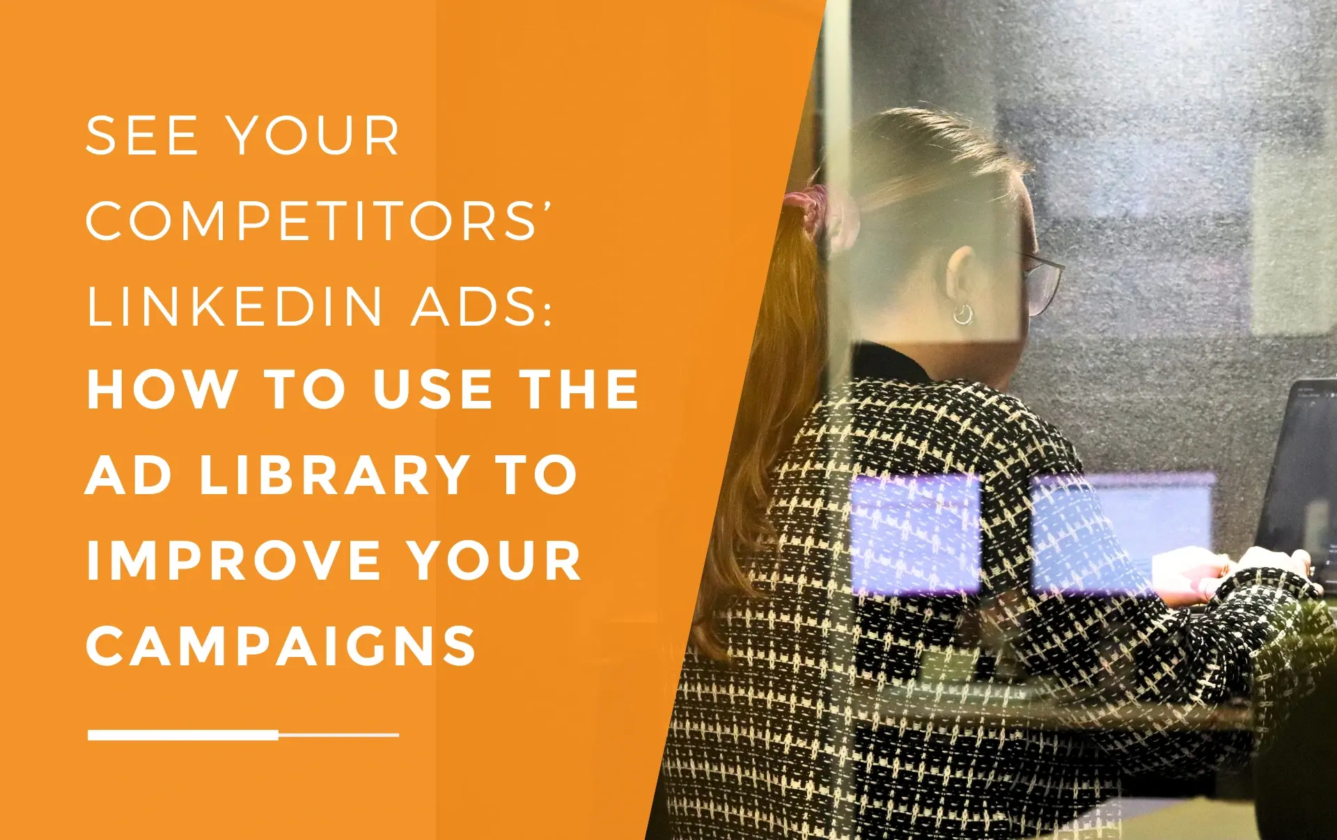 Ellis from JDR working on a laptop inside a quiet office booth, viewed through the glass panel.