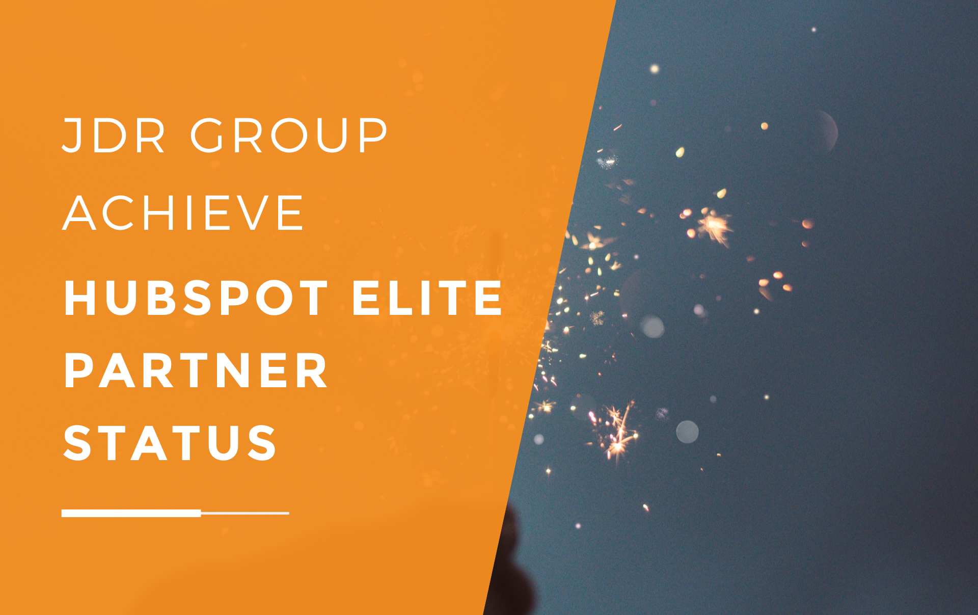 JDR Group holding up a sparkler in celebration of achieving HubSpot Elite Partner Status