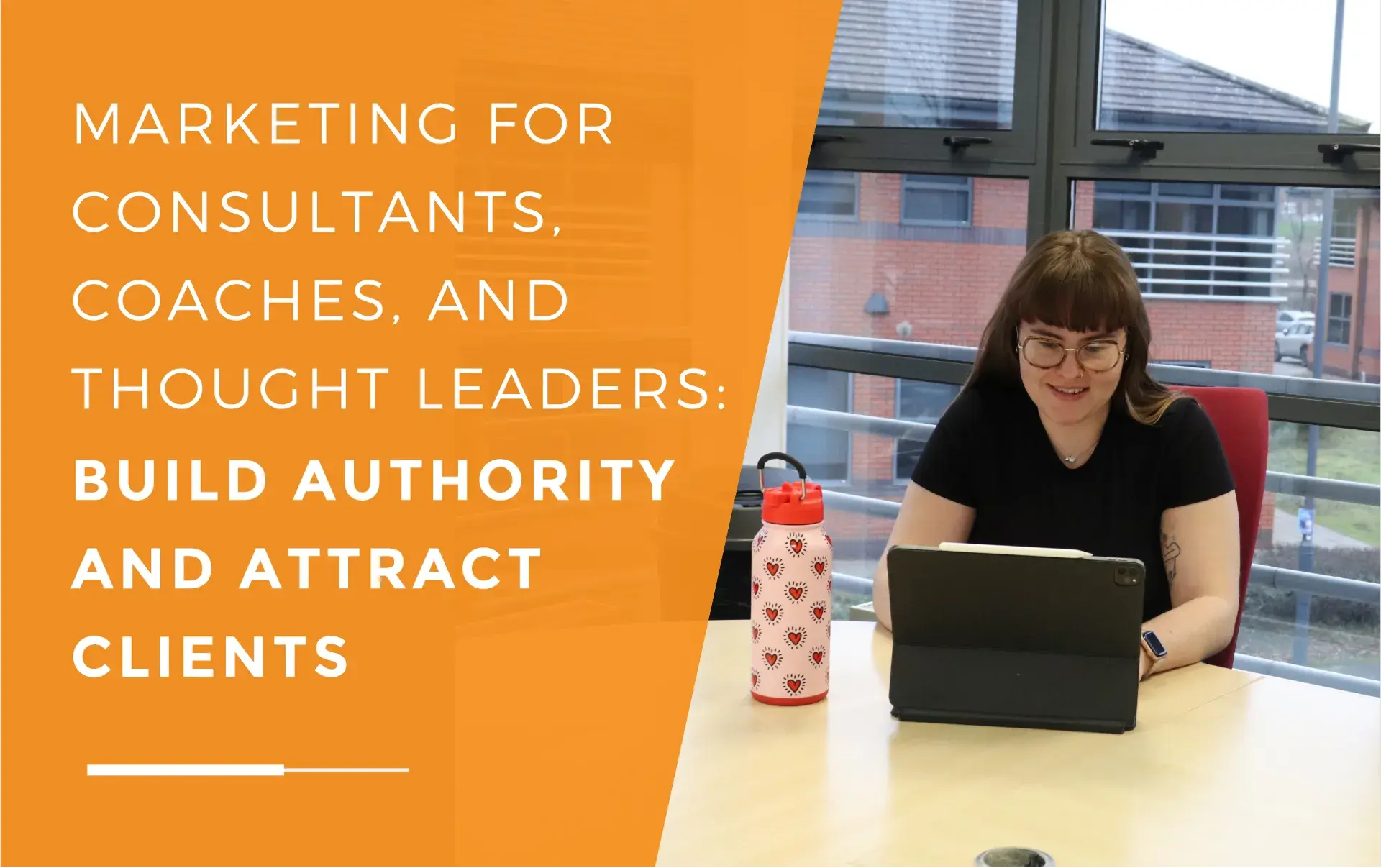 Ellis typing on her I pad with a water bottle next to her, discussing marketing strategies for coaches.