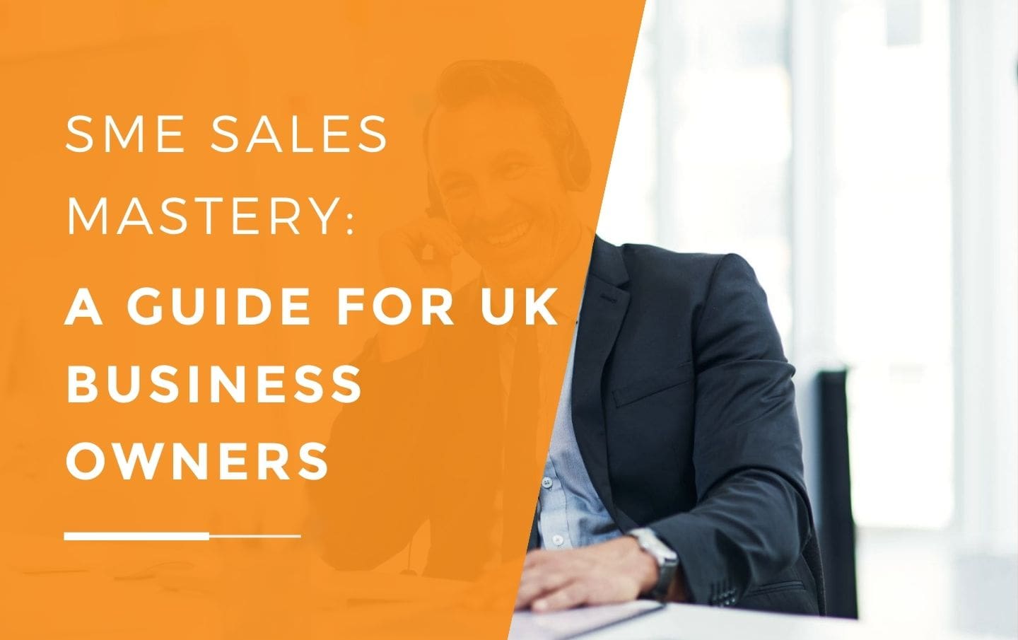 A small business owner at his desk with a desktop before him that he looks at and a headset on where he is talking to a lead about to win a sale masterfully.