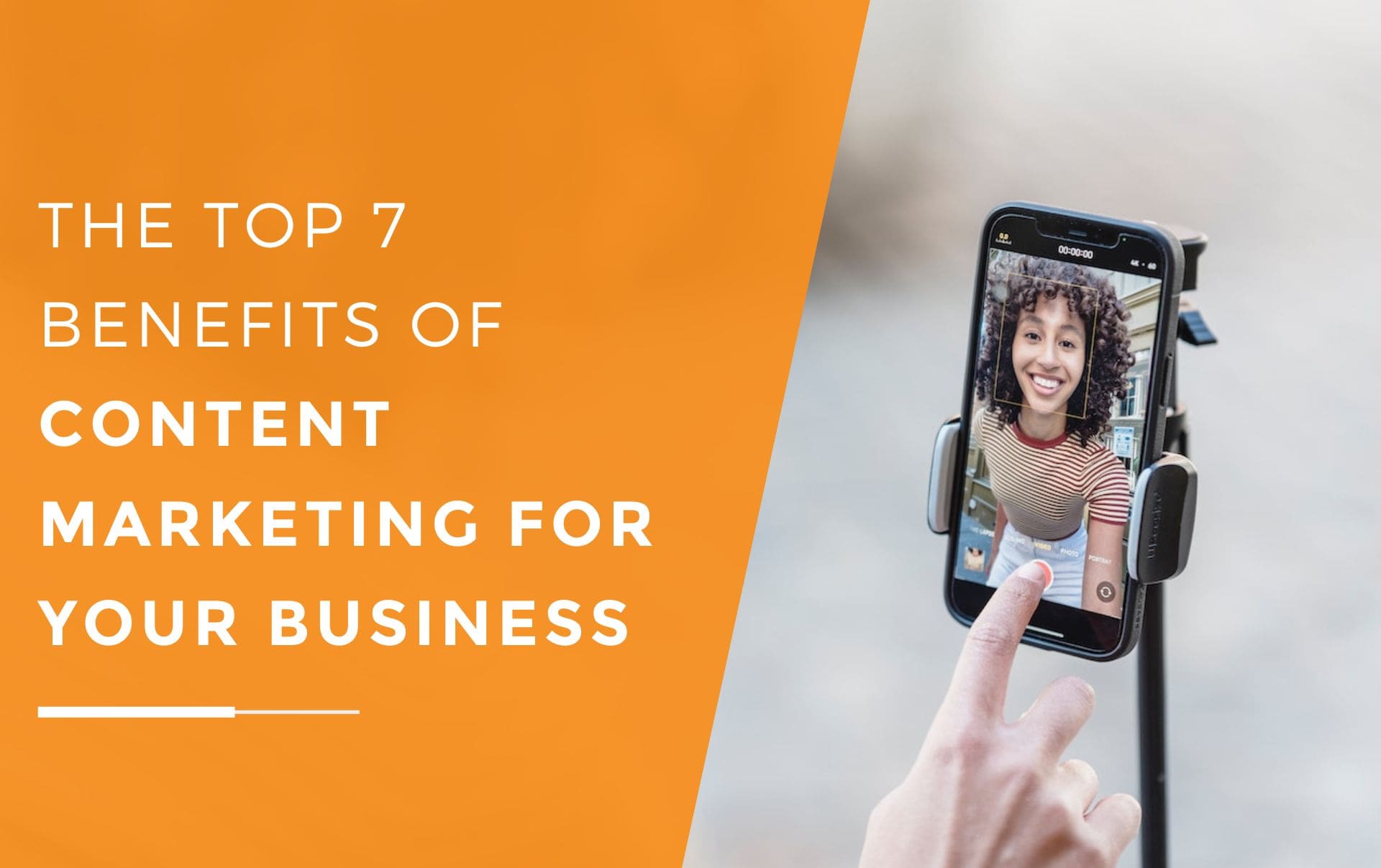a woman smiling into her smartphone screen which is on a tripod ready to create video marketing content for her business