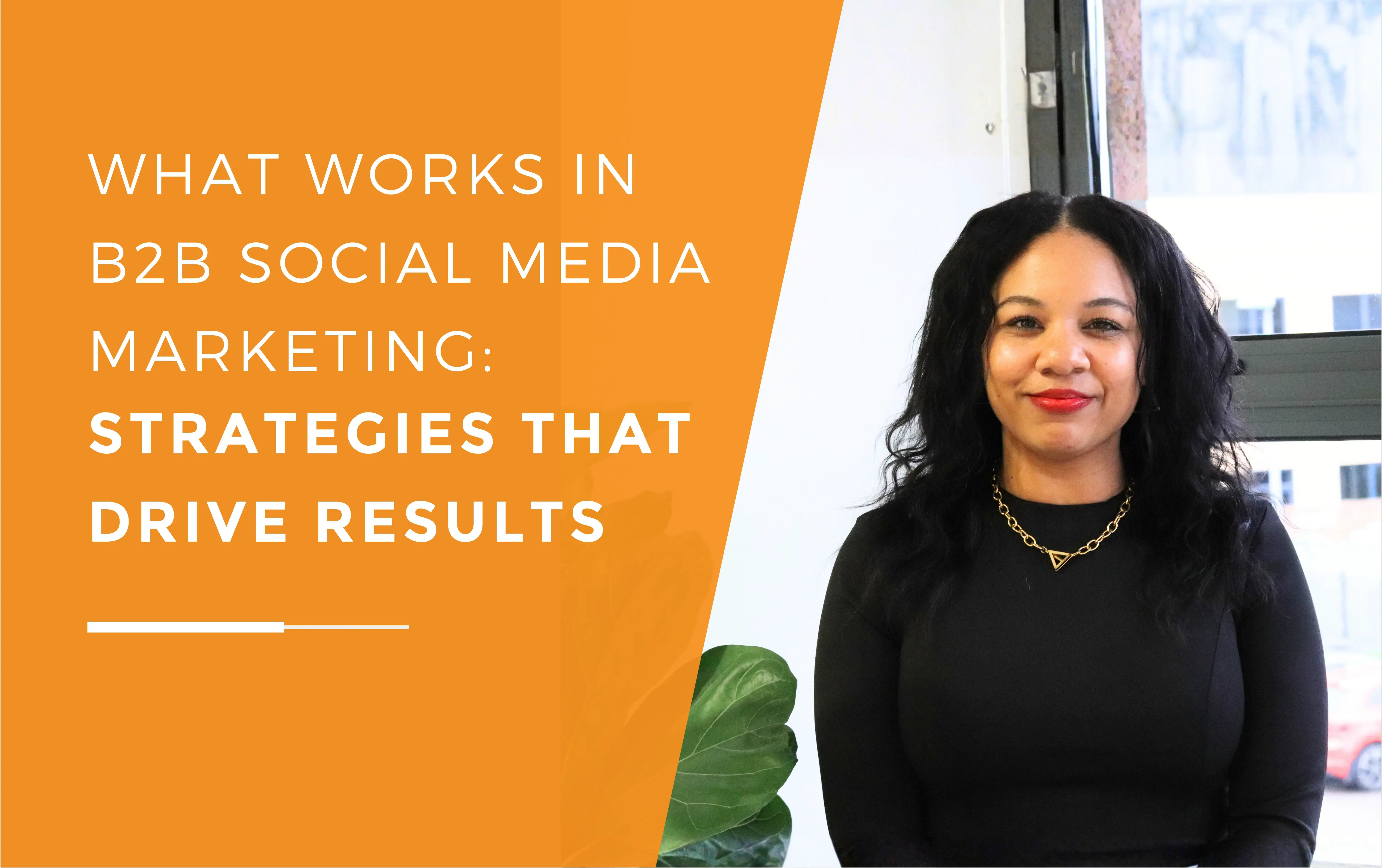 Kerry, who delivers social media marketing strategies, standing in the meeting room and smiling.