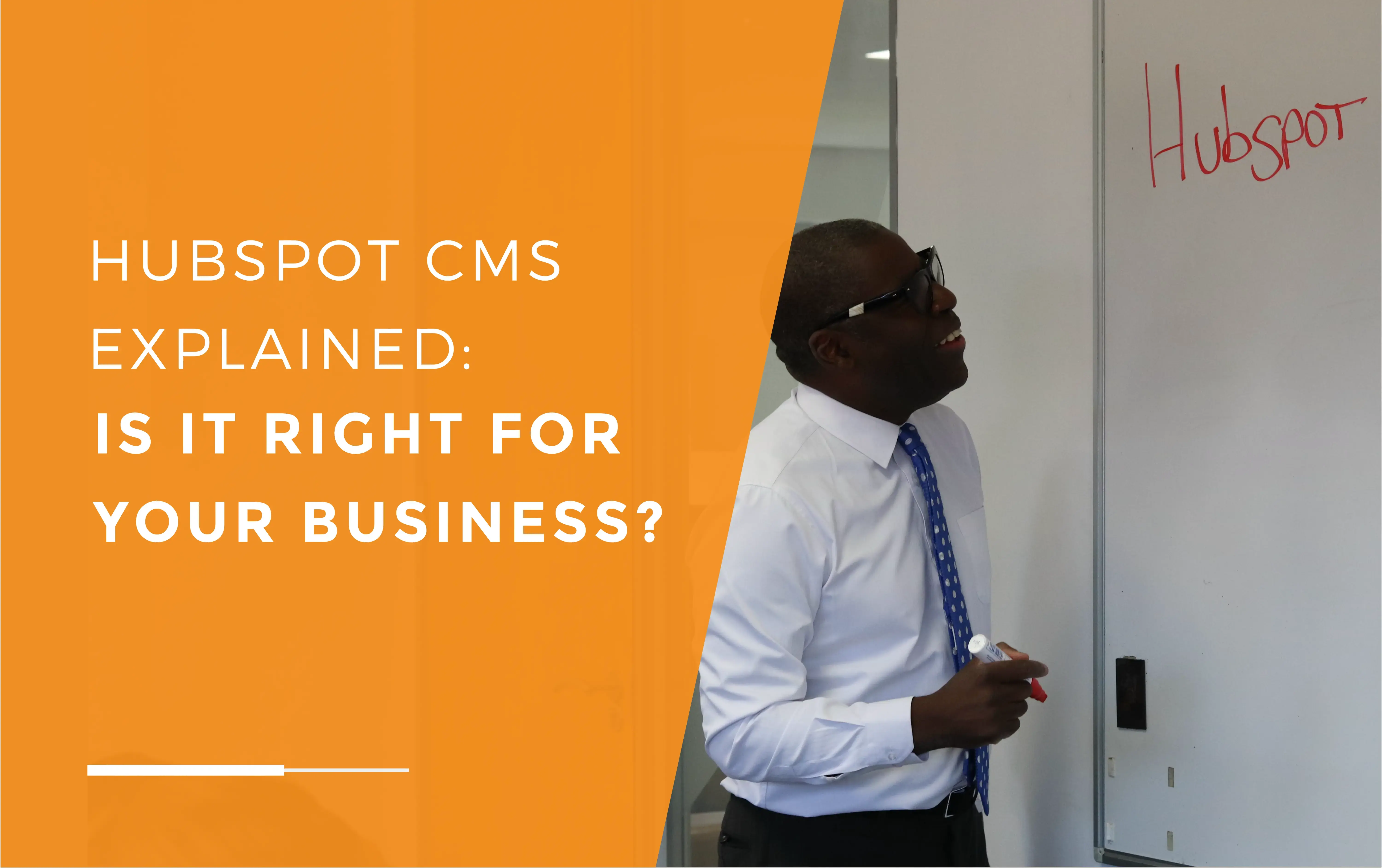 Dave, one of our directors, standing in front of a whiteboard with a pen in hand, the word 'Hubspot' written on the board.