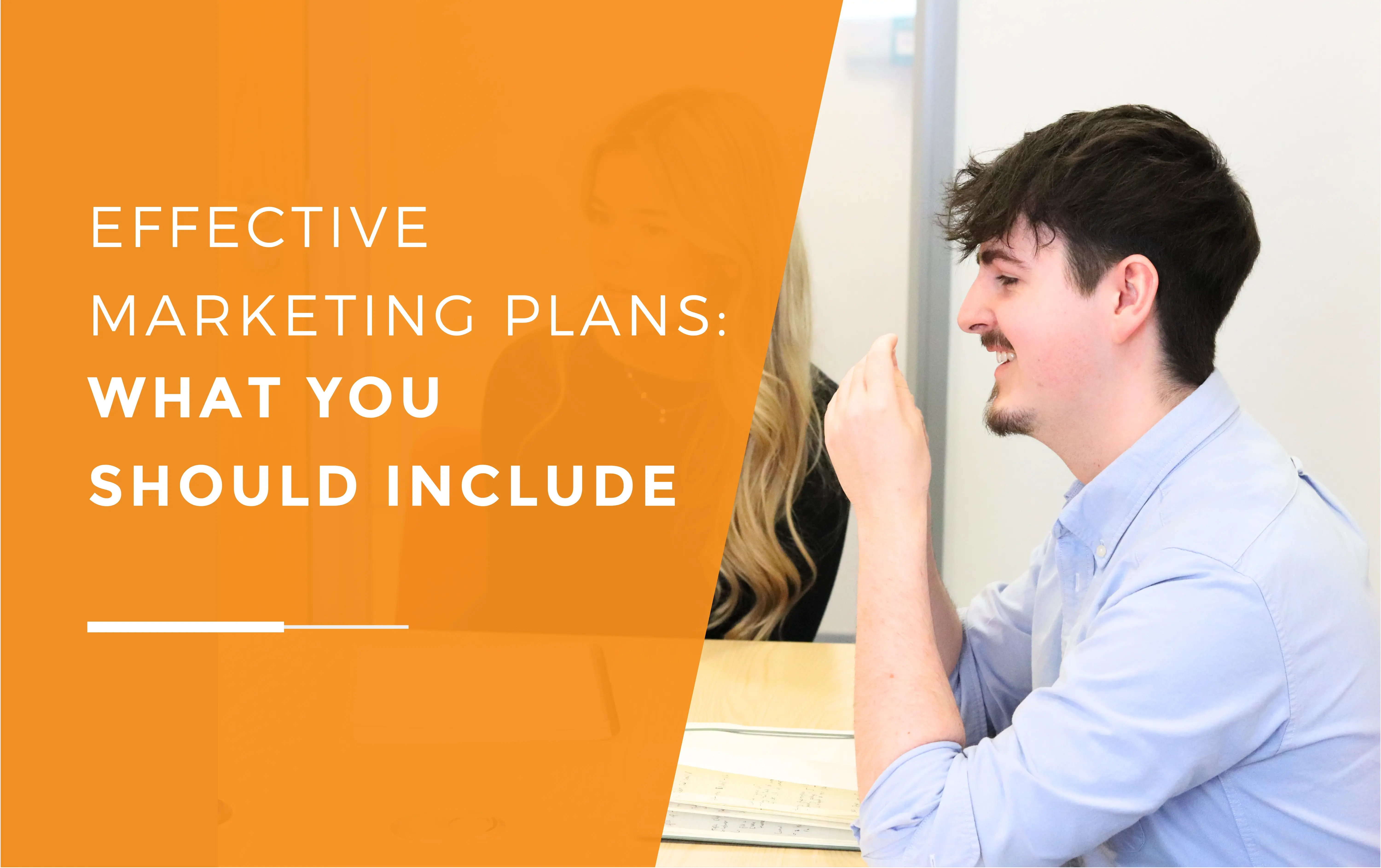 Harry smiling during a meeting discussing what to include in a marketing plan.