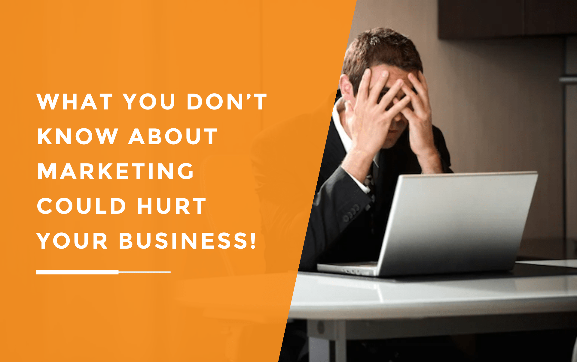 A man seated at a table, sitting in front of his laptop whilst looking stressed due to not knowing enough about marketing.